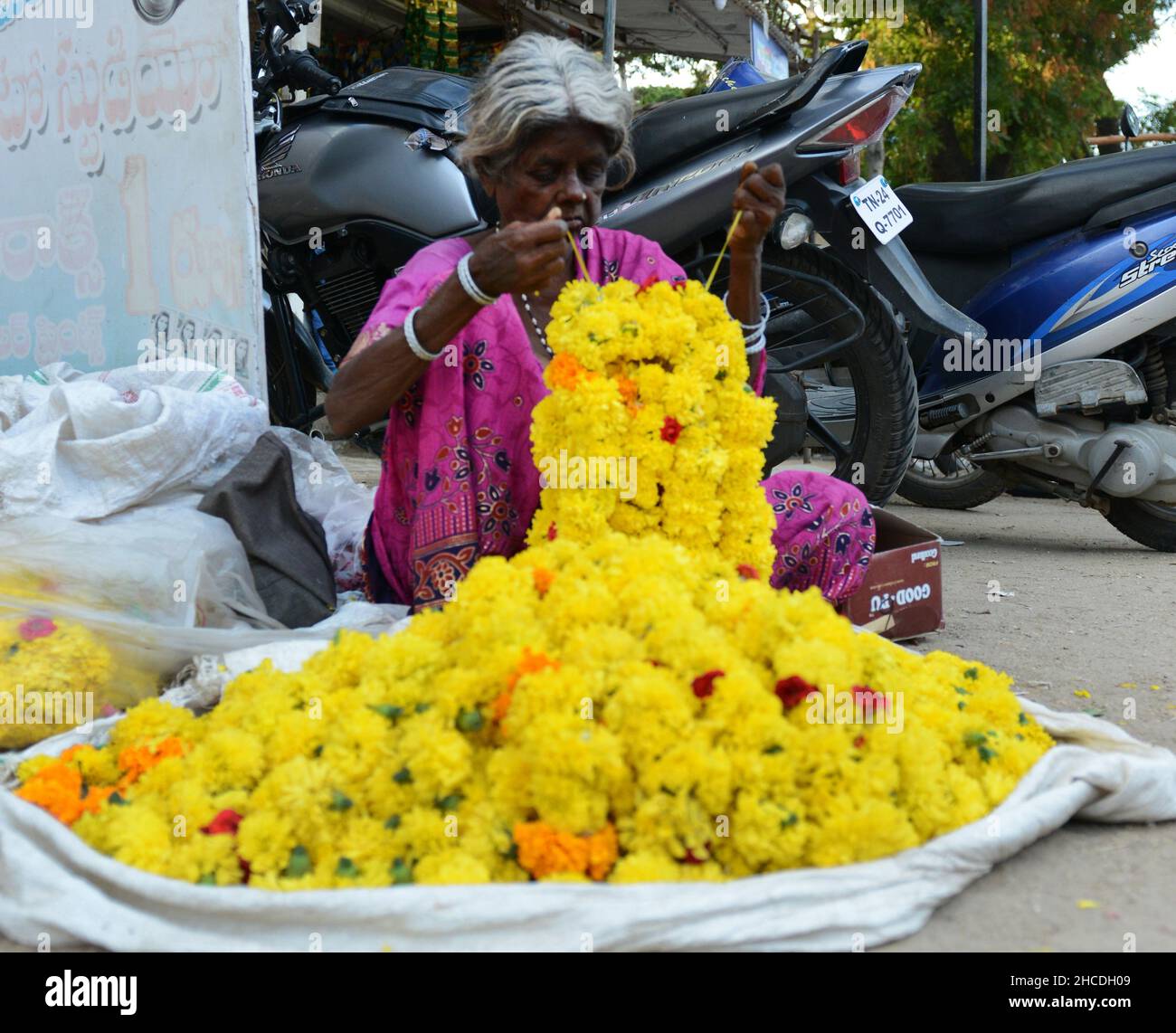 A colorful flower market in Kuppam, Andhra Pradesh, India. Stock Photo