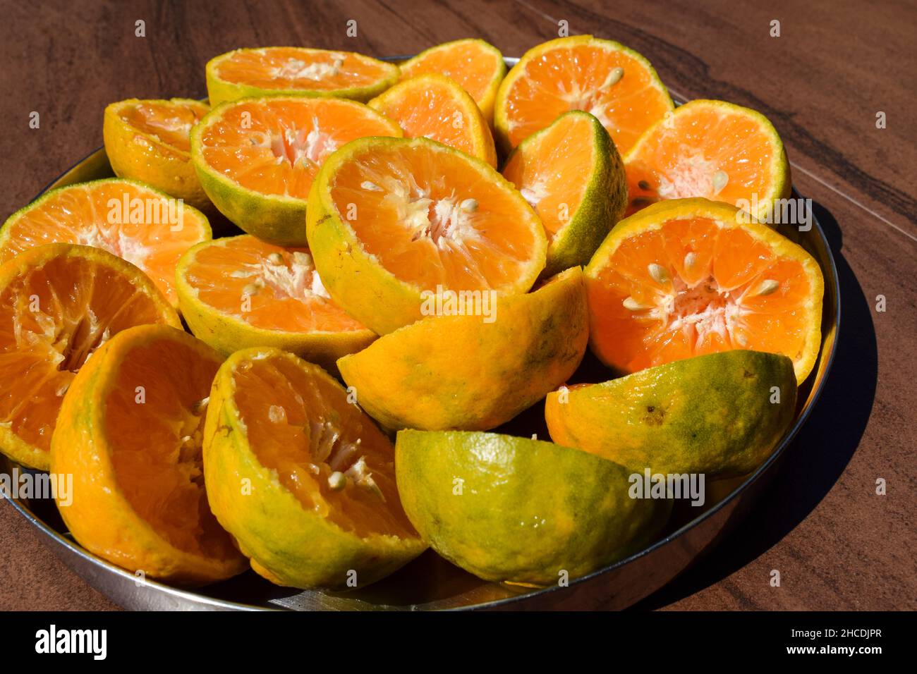 Orange, Malta fruits sliced in to half to take out juice Stock Photo