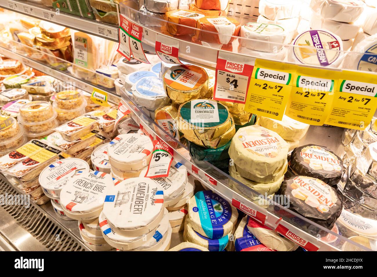 Australian and French cheeses including double brie and camembert on sale in a Sydney supermarket chilled section, NSW,Australia Stock Photo