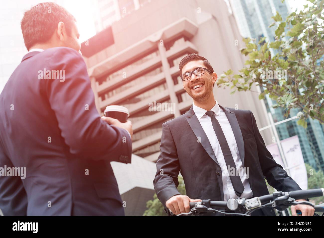 Two businessmen having walk Stock Photo - Alamy