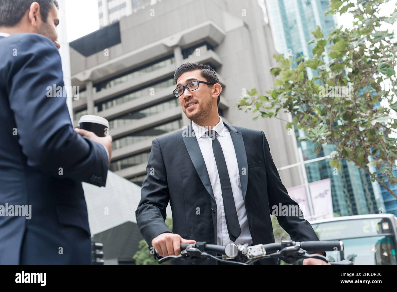 Two businessmen having walk Stock Photo - Alamy
