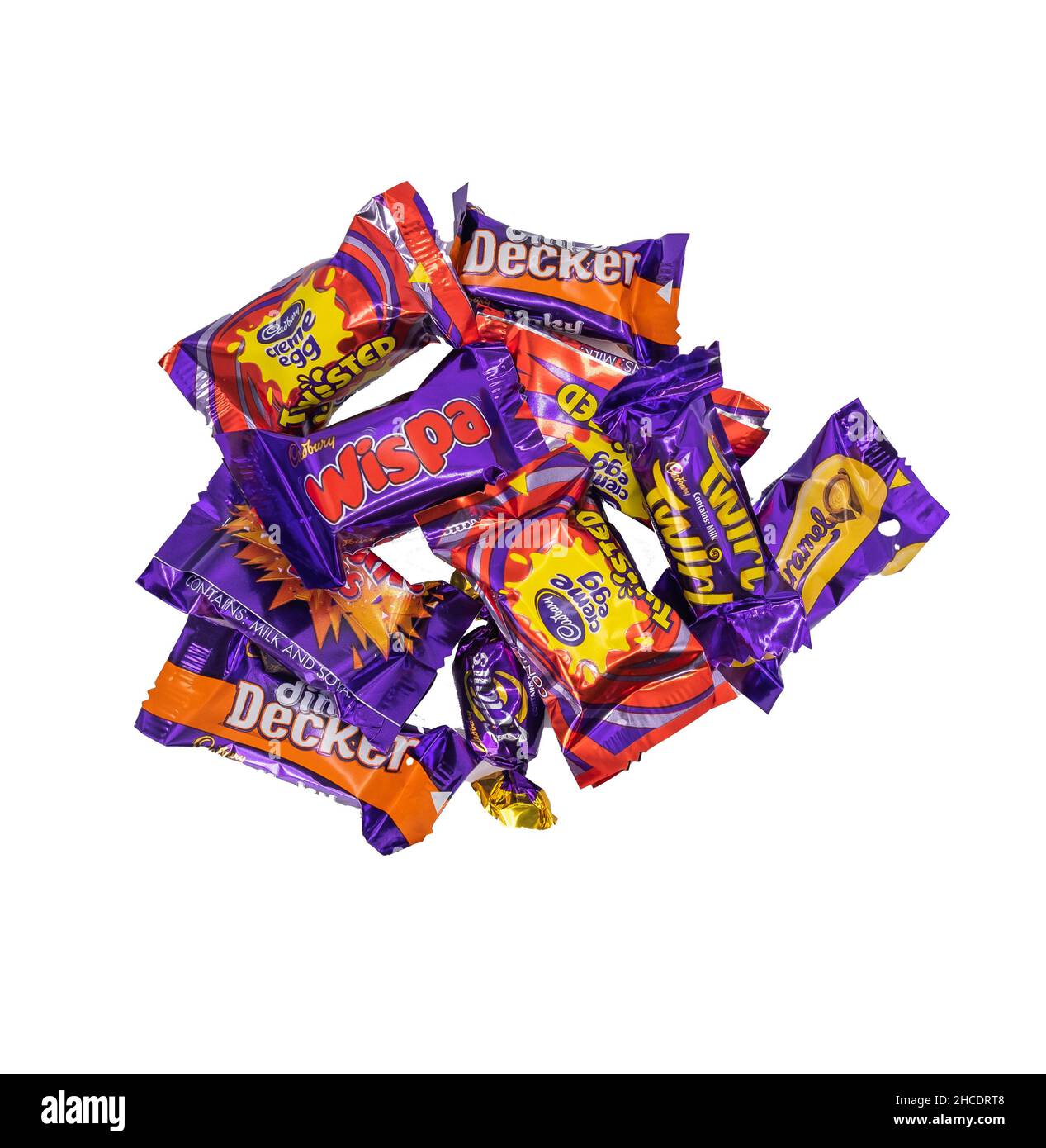 Norwich, Norfolk, UK – December 2021. Various individual bars of chocolate from a box of Cadbury Heroes chocolates cut out and isolated on a plain whi Stock Photo