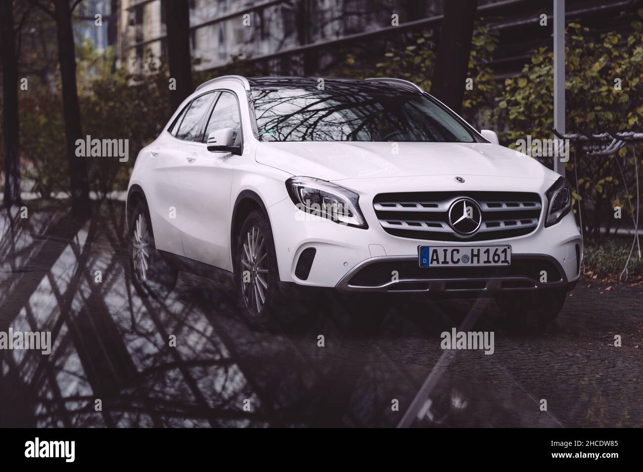 Mercedes Benz A-Class parked in Munich, Germany in the autumn next to an office building Stock Photo