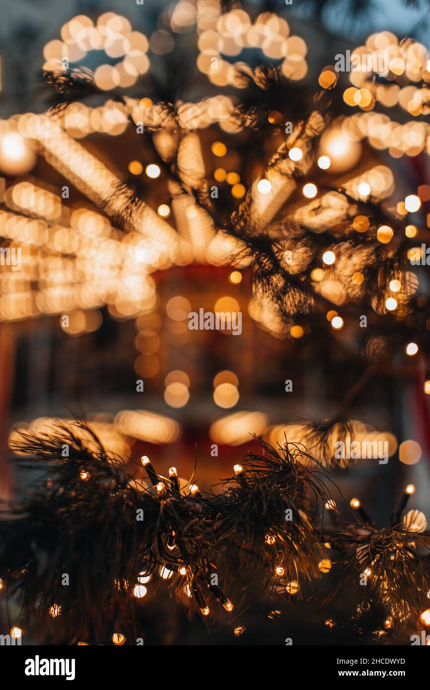 Golden magic glittering bokeh lights of festive New Year garland. Christmas sparkling background for greeting card Stock Photo