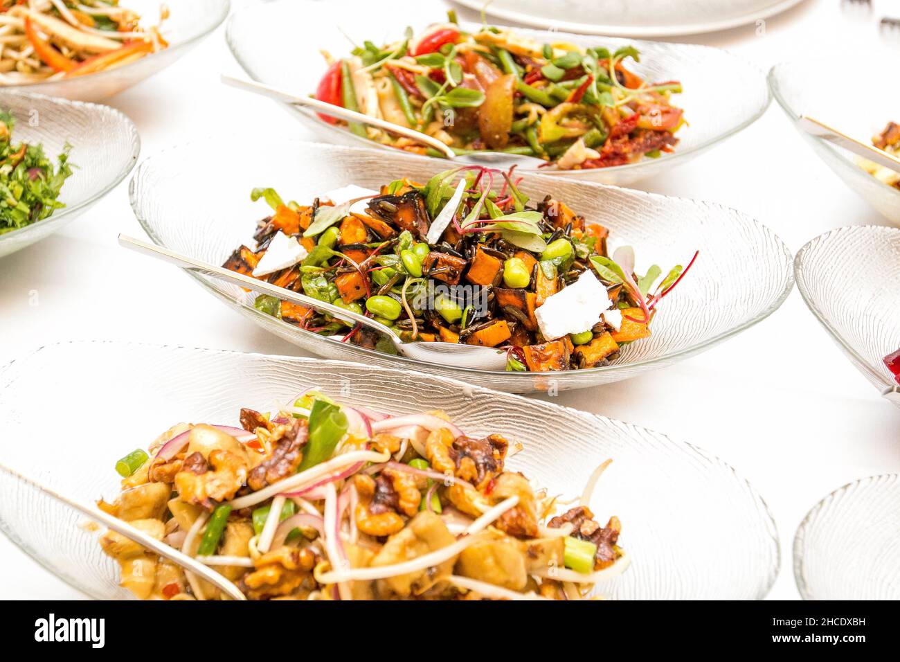 Salad bowls on a buffet table Stock Photo