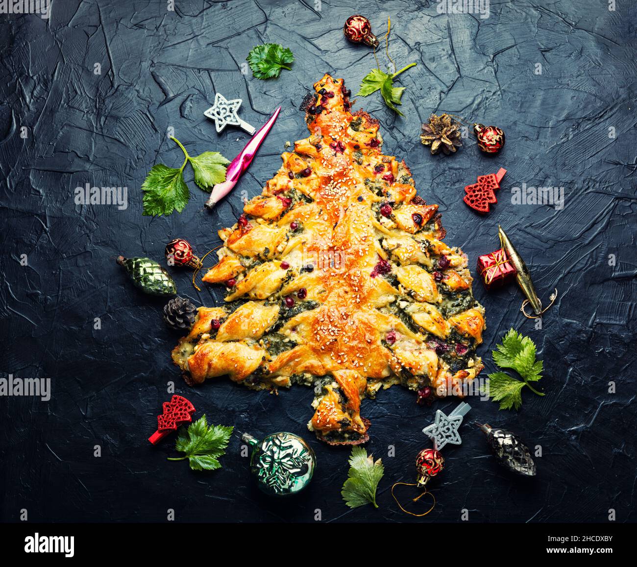 Homemade cakes in the shape of a Christmas tree. Spinach pie with