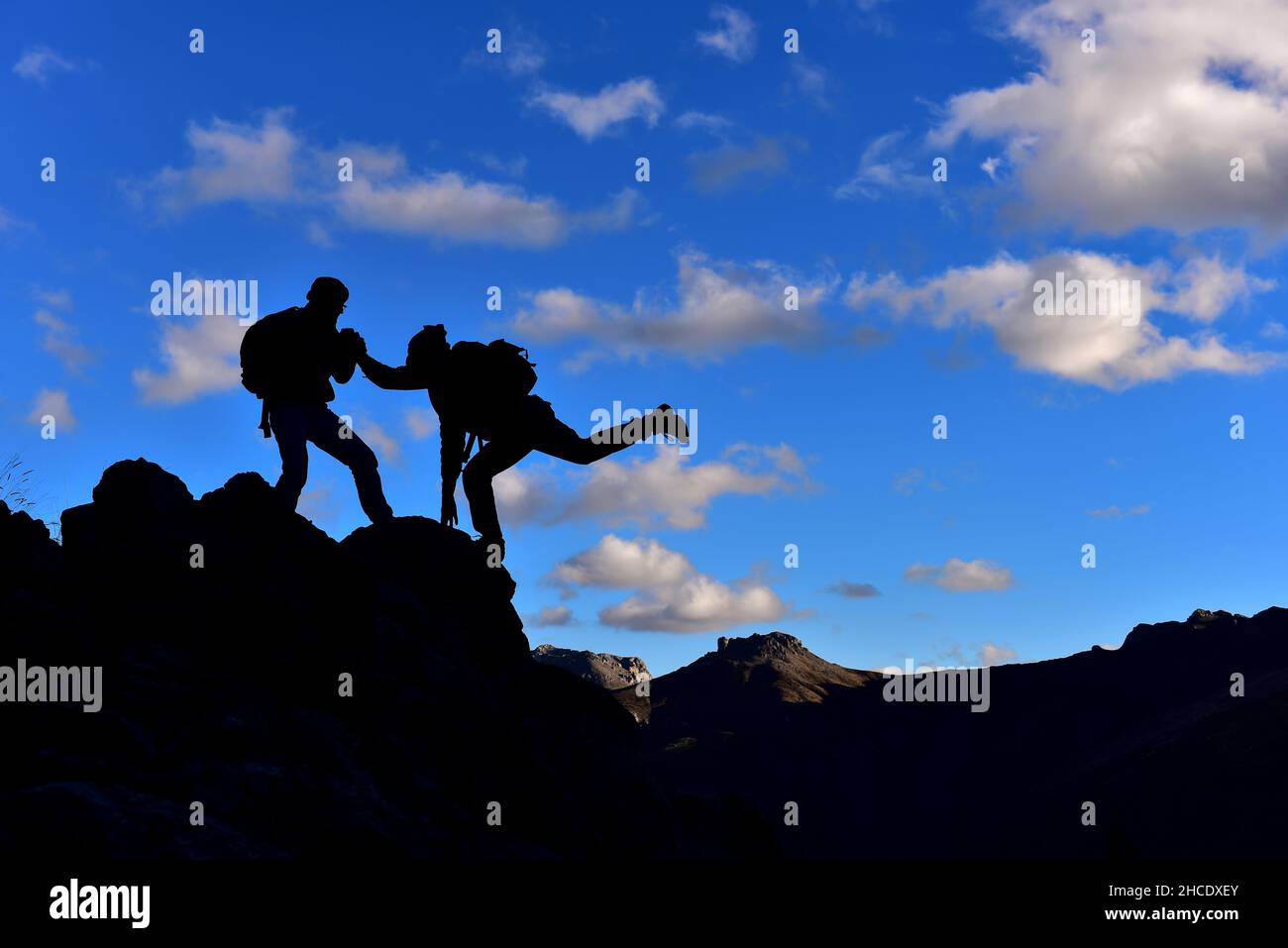 challenging mountains and mountaineering cooperation Stock Photo