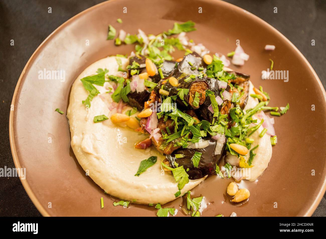 A serving of eggplant with Hummus and Tahini Stock Photo