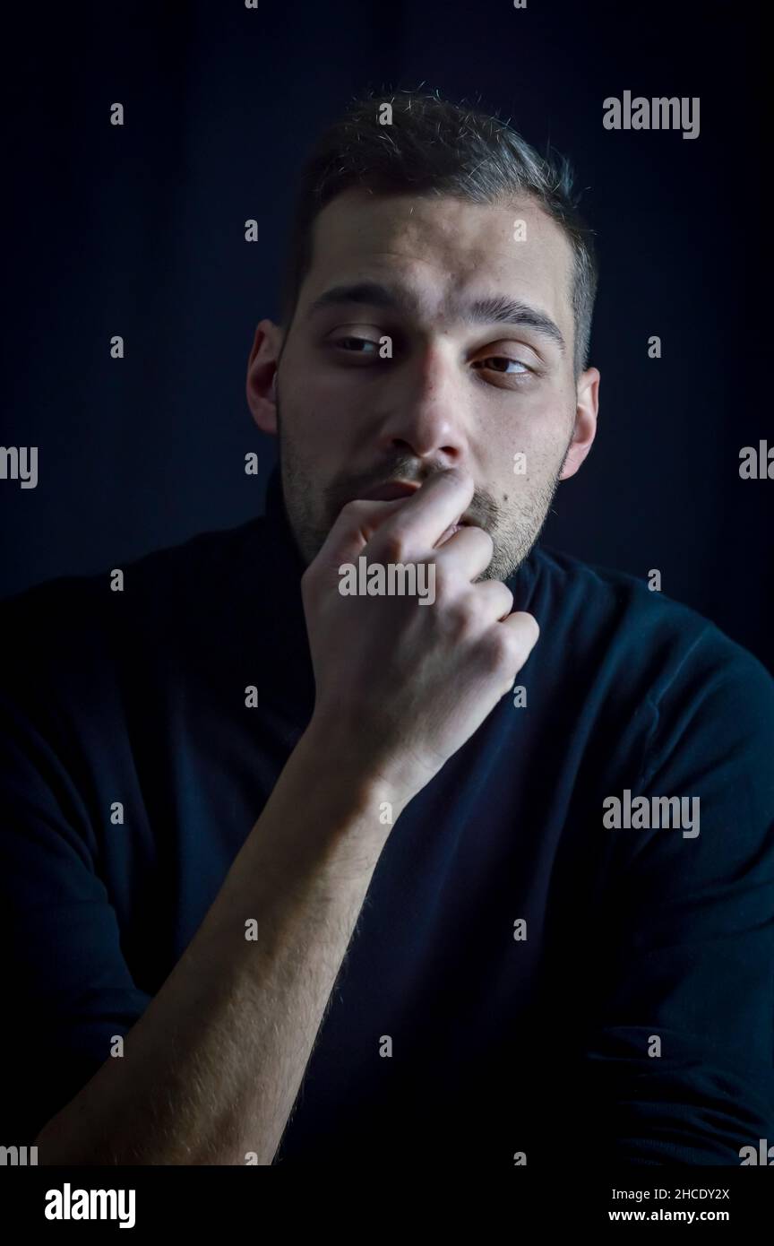 Pensive young man thinking work hi-res stock photography and images - Alamy