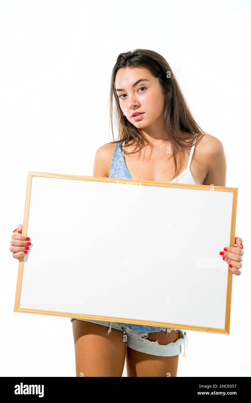 Young model hold a blank whiteboard ready for your text Stock Photo