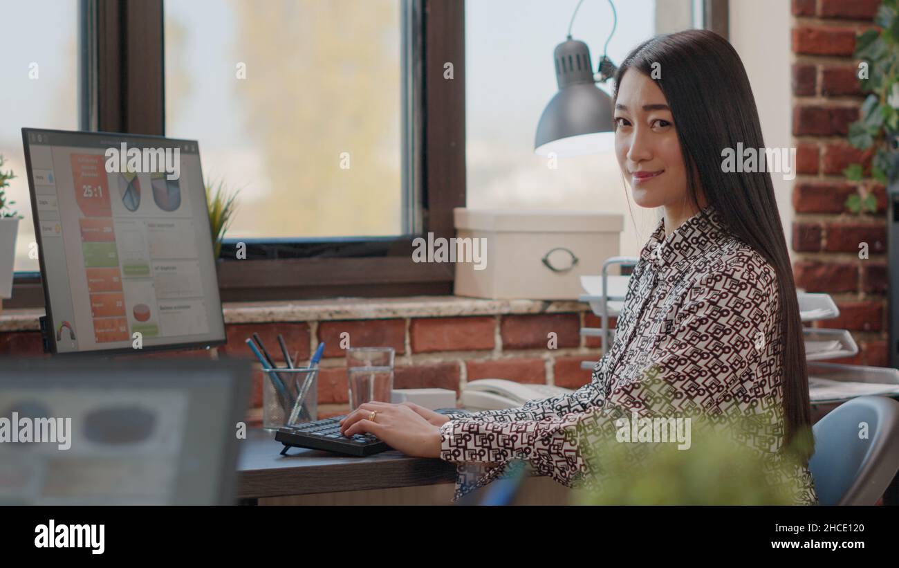 Employees Using Technology Portrait of business woman working on computer to plan project in ...