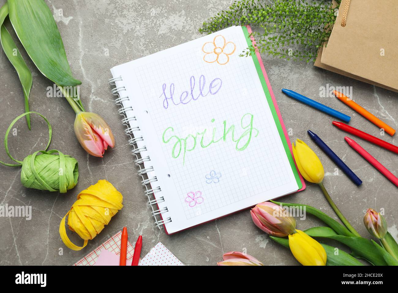Hello spring concept on gray textured background Stock Photo