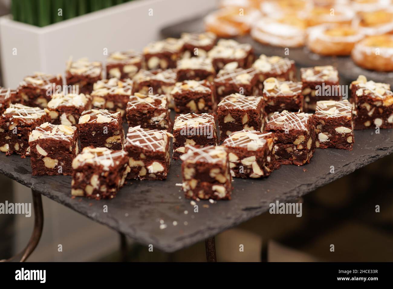 Chocolate brownies with almond on banquet table Stock Photo