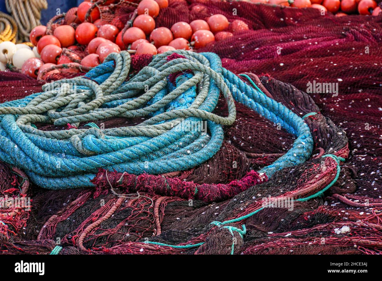A heap of Red Fish Nets and ropes Stock Photo