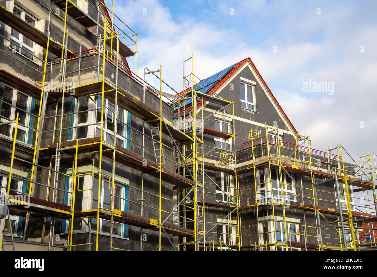 Thermal insulation of a house facade on a new building Stock Photo - Alamy