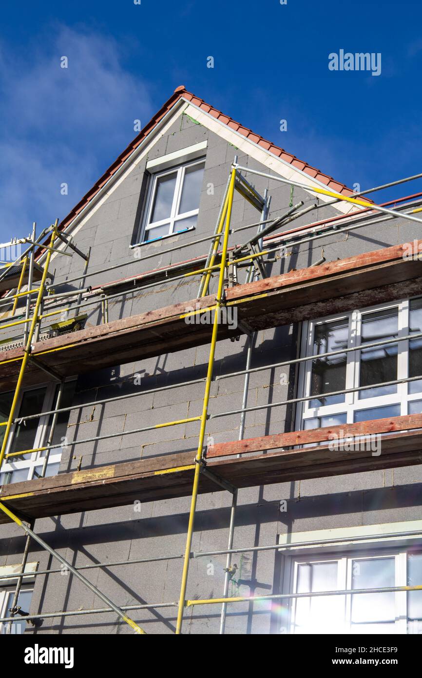 Thermal insulation of a house facade on a new building Stock Photo - Alamy