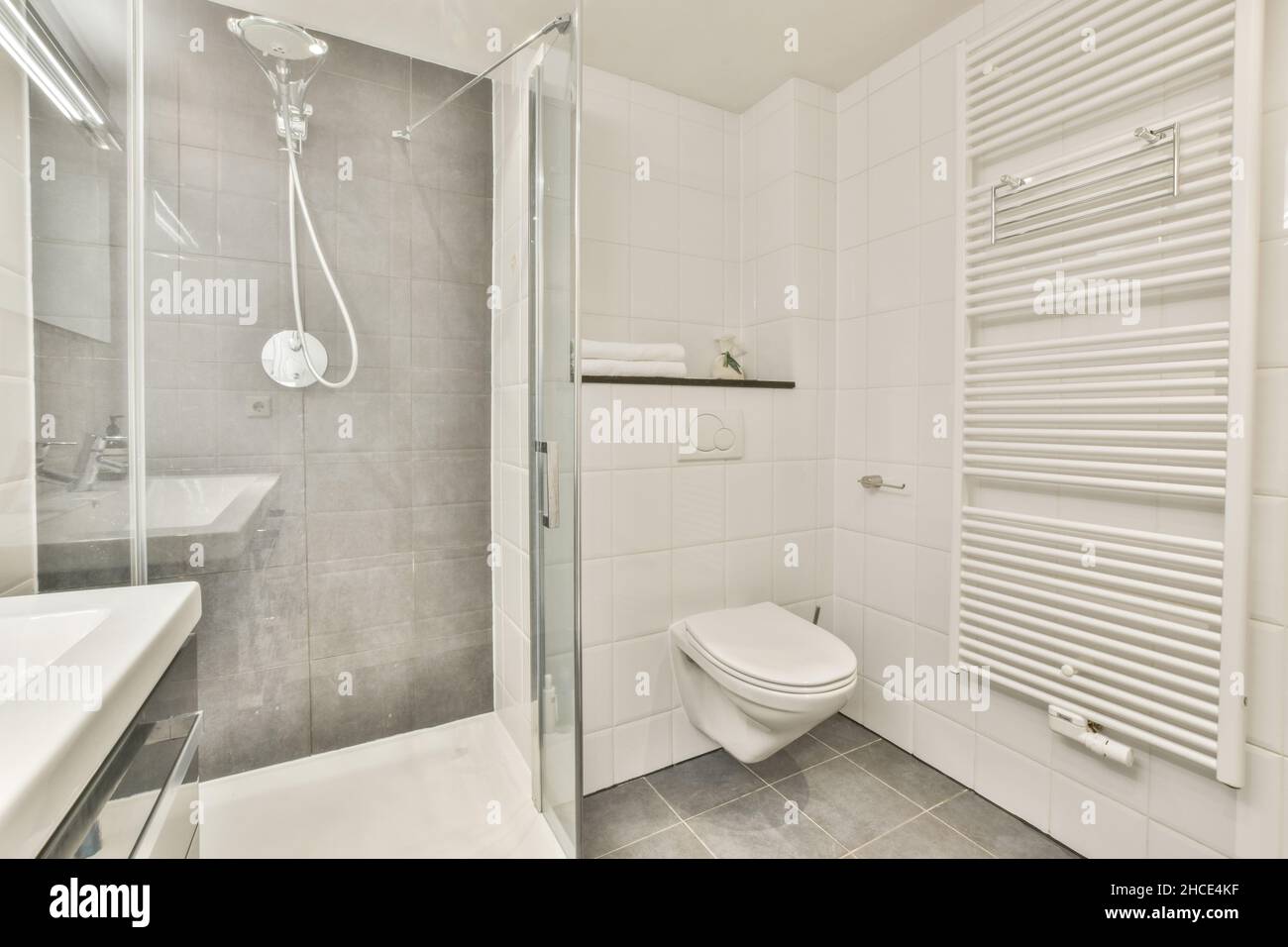 Interior of modern tiled bathroom with shower cabin ceramic white ...