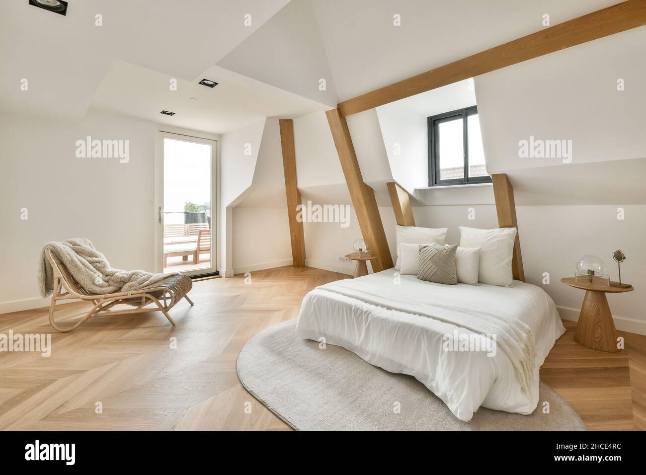 Interior of spacious light contemporary bedroom furnished with