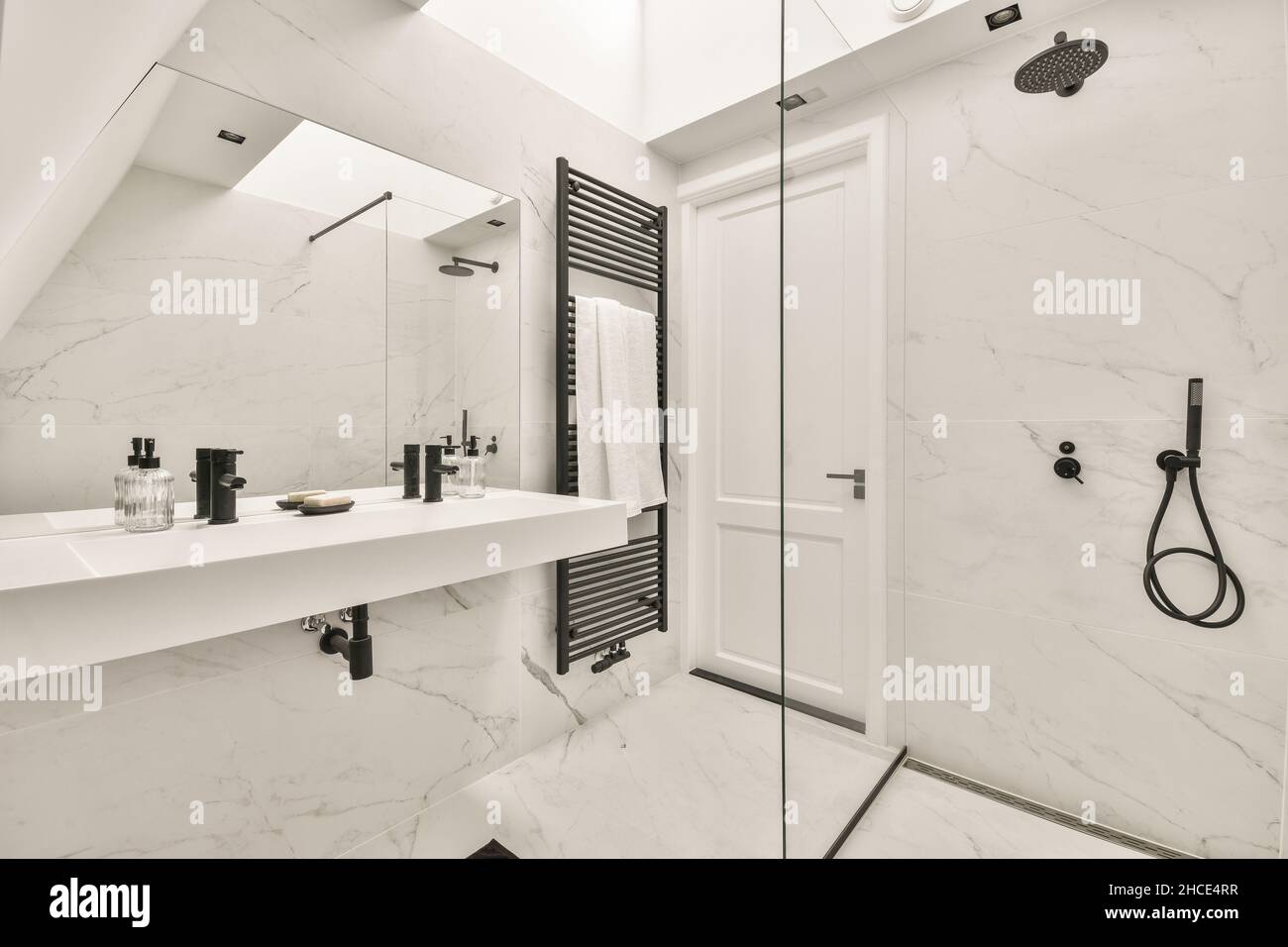 Modern white marble bathroom interior design with glass shower cabin ...