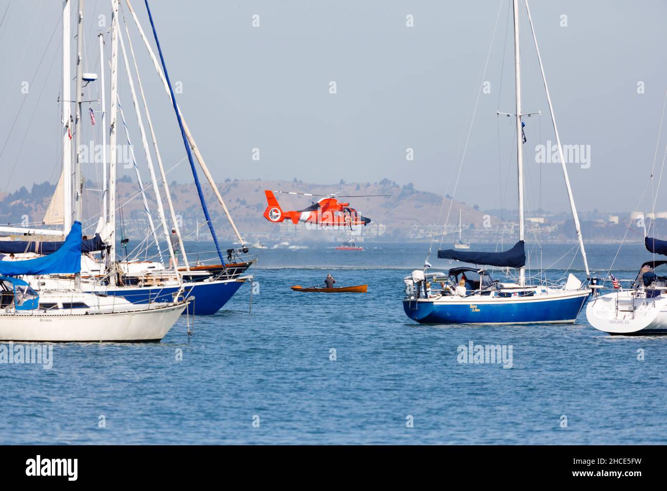 Eurocopter Dolphin of the US Coast Guard demonstrates a rescue in San Francisco Bay during Fleet Week 2019. Stock Photo