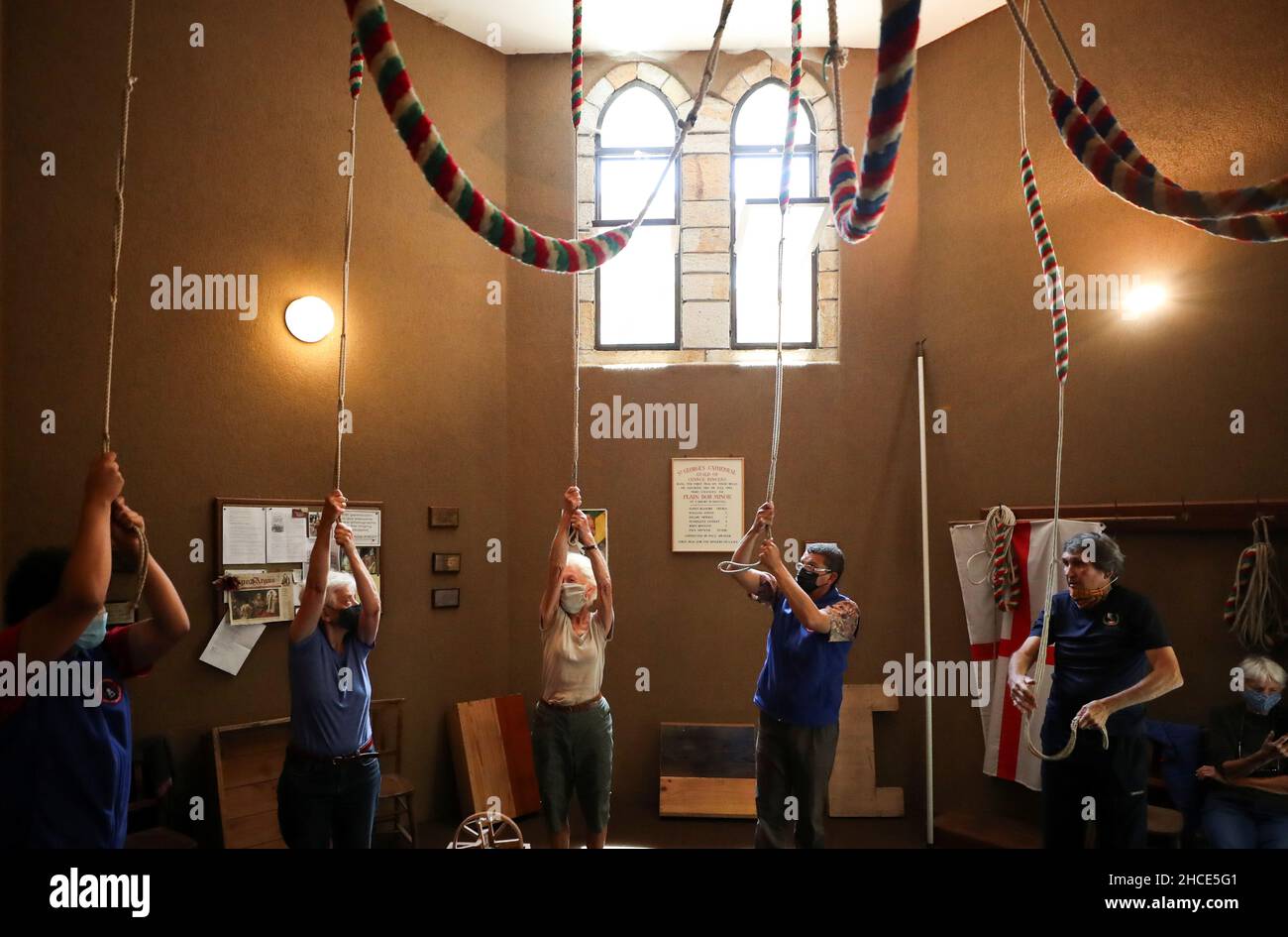 Bellringers sound the peals at midday to honour the late Archishop Desmond Tutu at St Georges cathedral in Cape Town, South Africa, December 28, 2021. REUTERS/Mike Hutchings Stock Photo