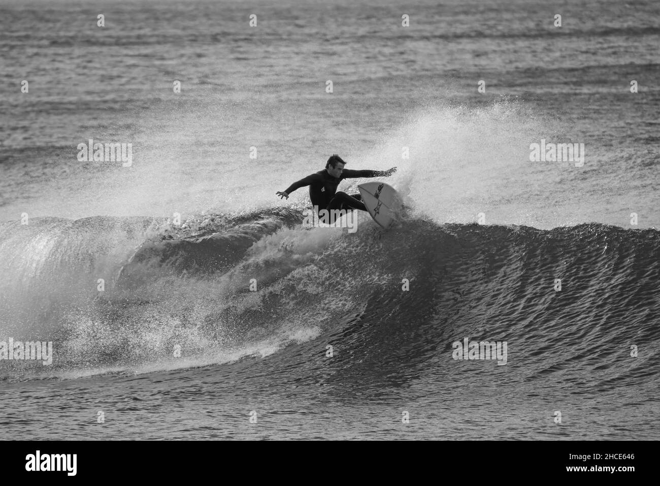 Surfer on a perfect wave at sunny day Stock Photo
