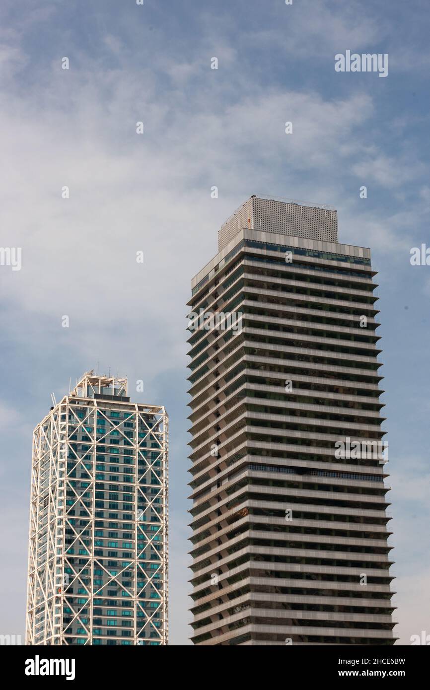 Vertical shot of modern buildings under the cloudy skies Stock Photo ...