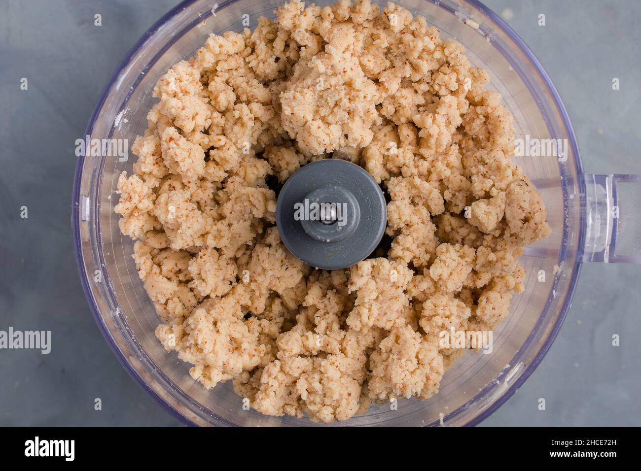 https://c8.alamy.com/comp/2HCE72H/from-above-blender-bowl-with-dough-while-preparing-pie-2HCE72H.jpg