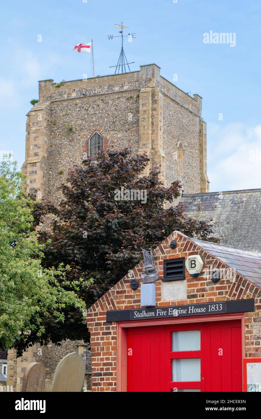 Stalham, Norfolk. St. Mary’s Church tower, with the 1833 Fire Engine House now a museum, in foreground. Site historical, social interest for visitors. Stock Photo