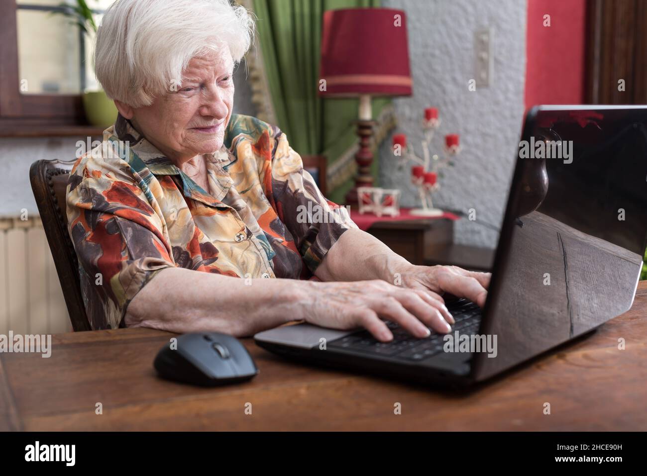 Old woman hands typing on a laptop keyboard Stock Photo - Alamy
