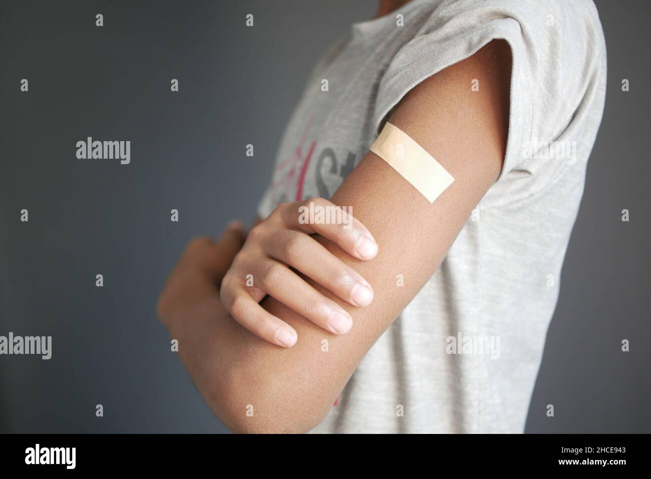 adhesive bandage on young man's arm  Stock Photo