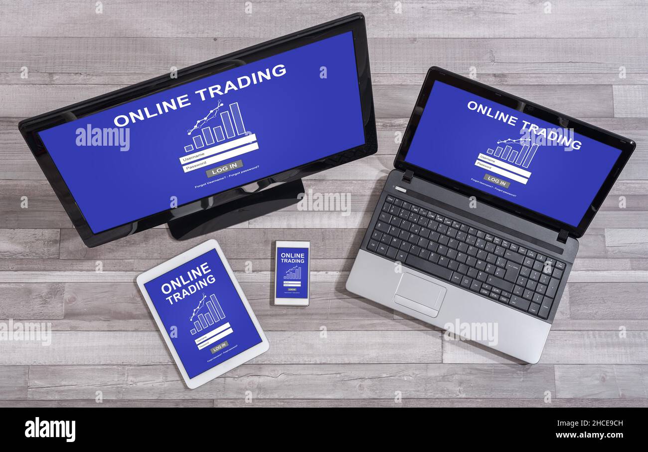 Online trading concept shown on different information technology devices Stock Photo