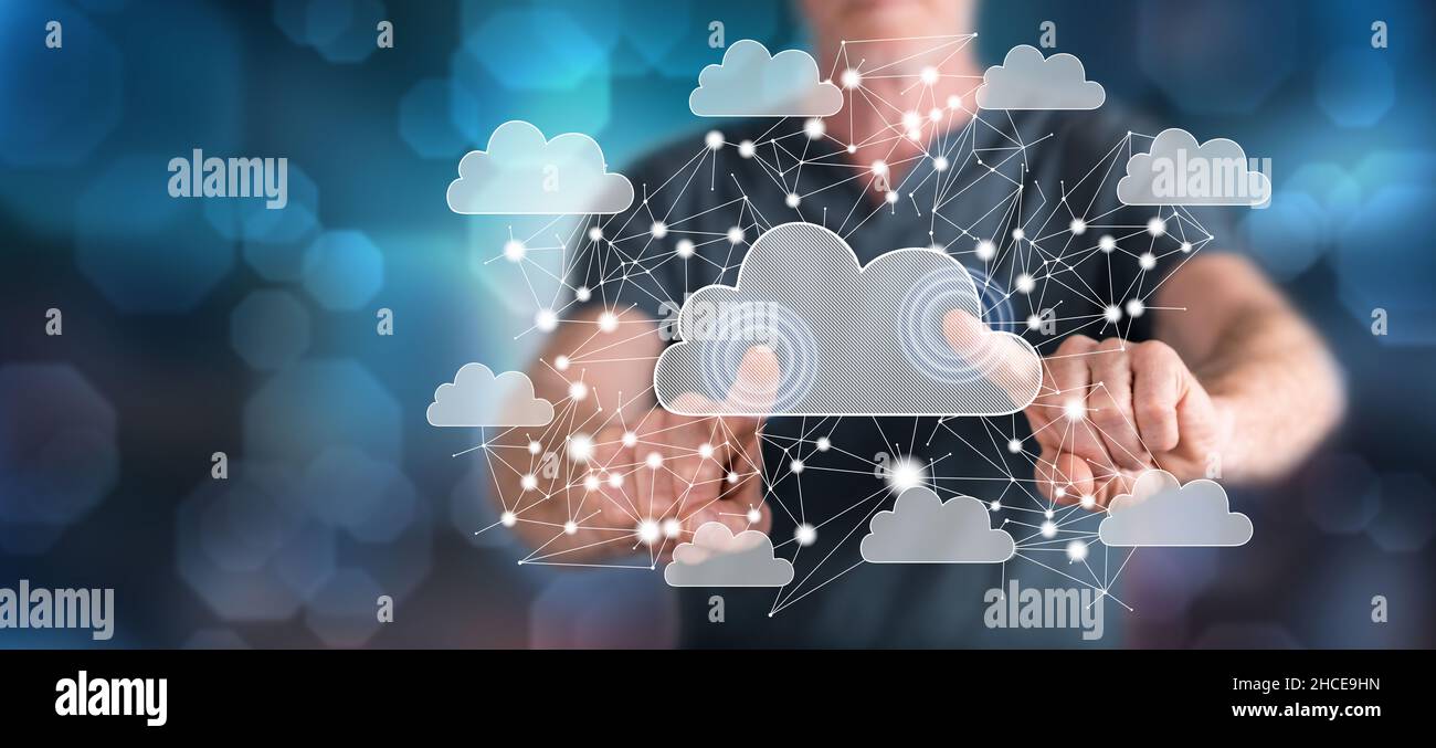 Man touching a cloud networking concept on a touch screen with his ...