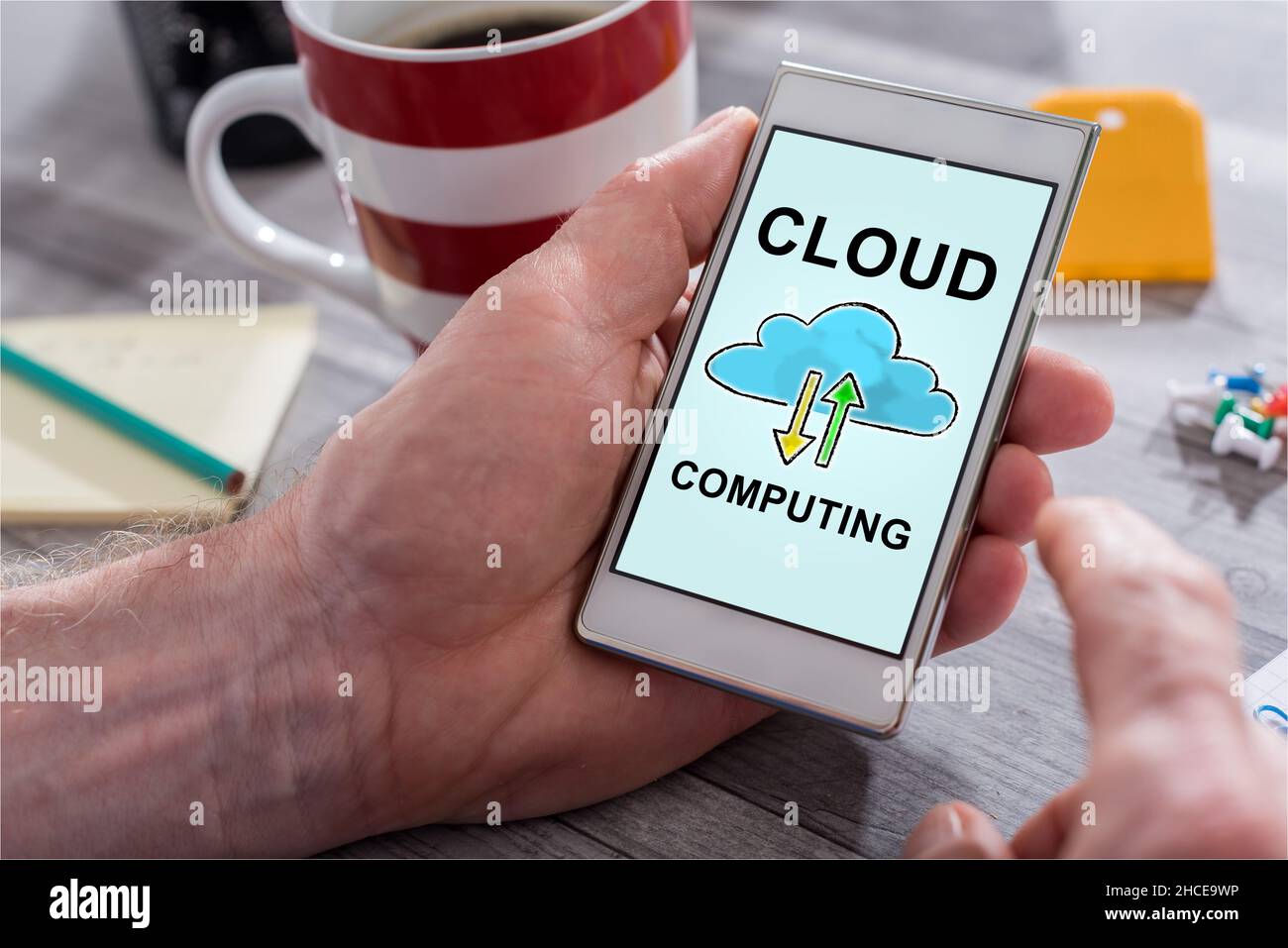 Male hand holding a smartphone with cloud computing concept Stock Photo ...
