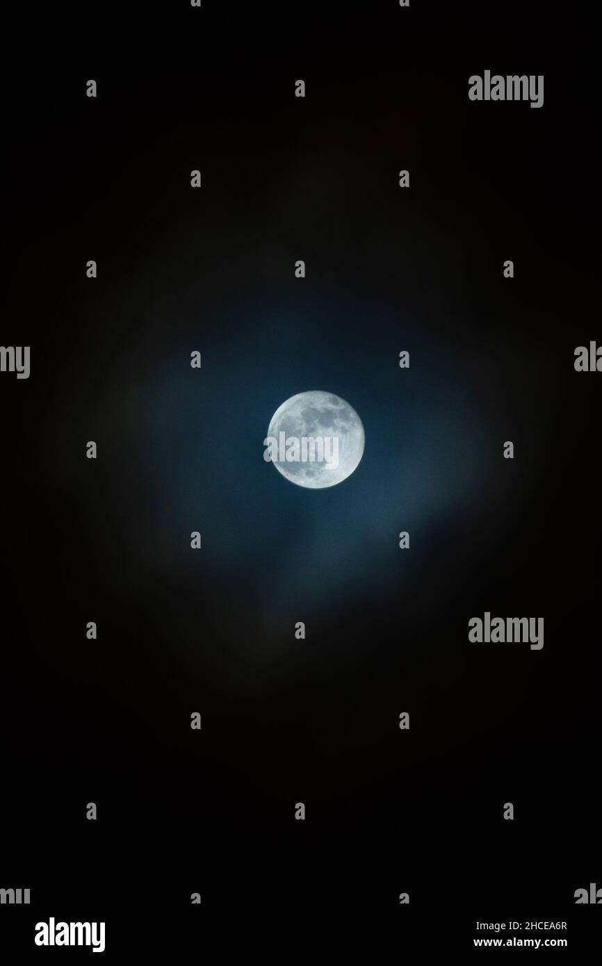 Vertical shot of the full moon in the night sky Stock Photo - Alamy