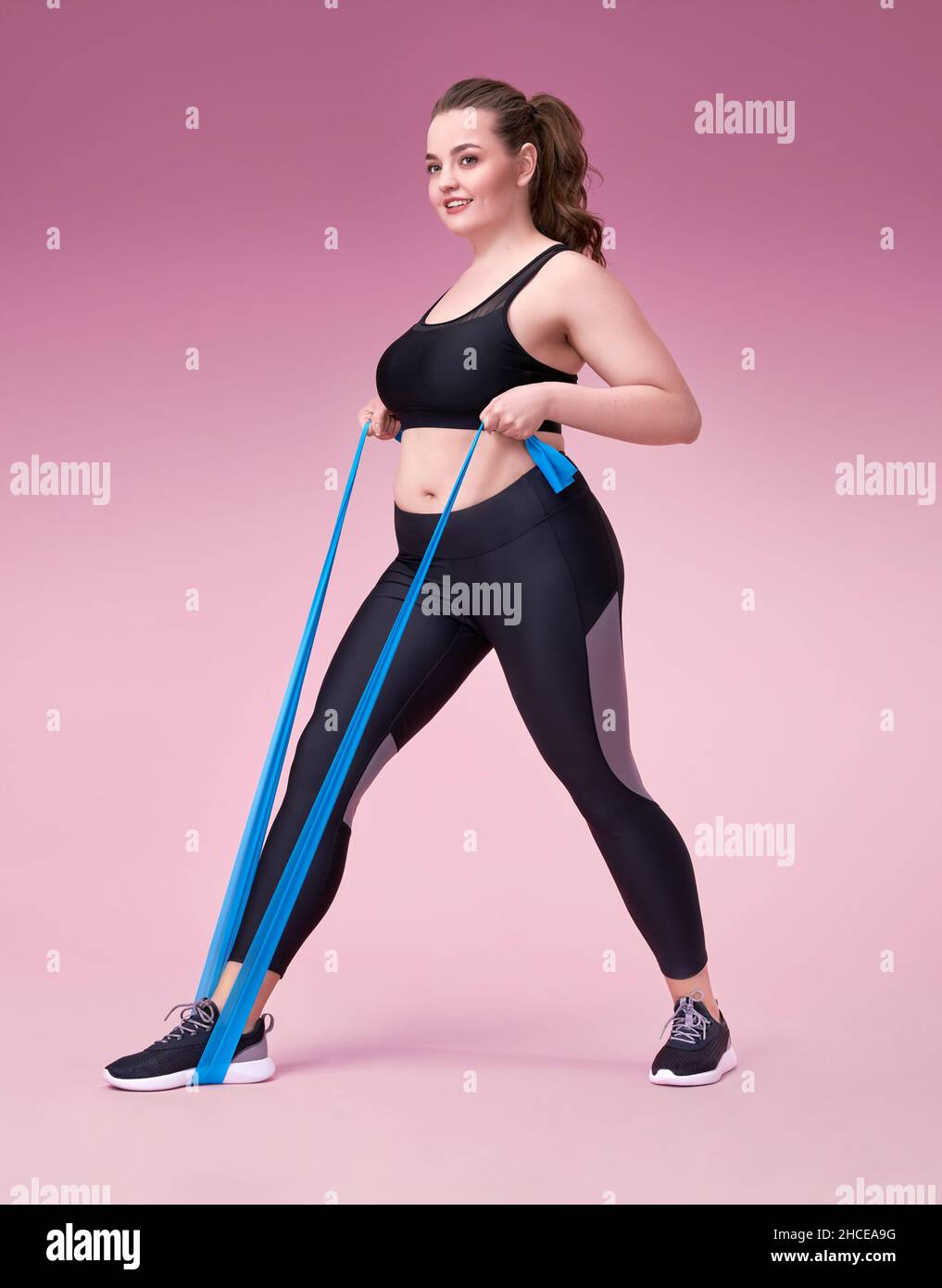 Plus size model doing fitness hi-res stock photography and images