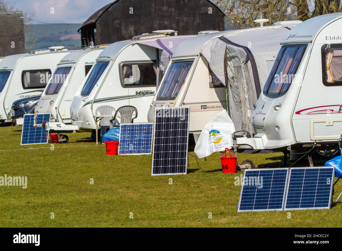 Caravans on a caravan rally using small solar panels to provide power