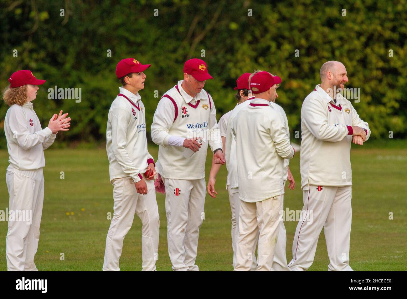 Players sanitizing hands before village cricket match between the Derbyshire teams of Brailsford and Clifton on the polo ground at Osmaston Derbyshire Stock Photo