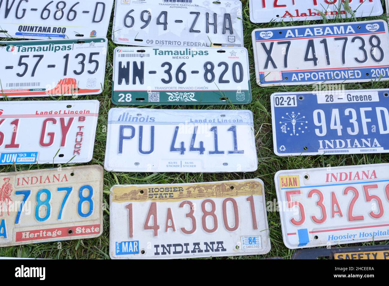 USA old vehicles license plates placed on the grass. Festival OLD CAR Land. May 12, 2019. KIev, Ukraine Stock Photo