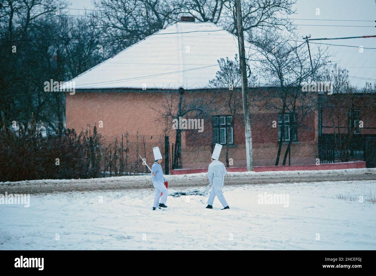 CHOMA, UKRAINE - DECEMBER 25, 2021 - Carollers go house to house during the Christmas celebration in Choma village inhabited by ethnic Hungarians, Ber Stock Photo