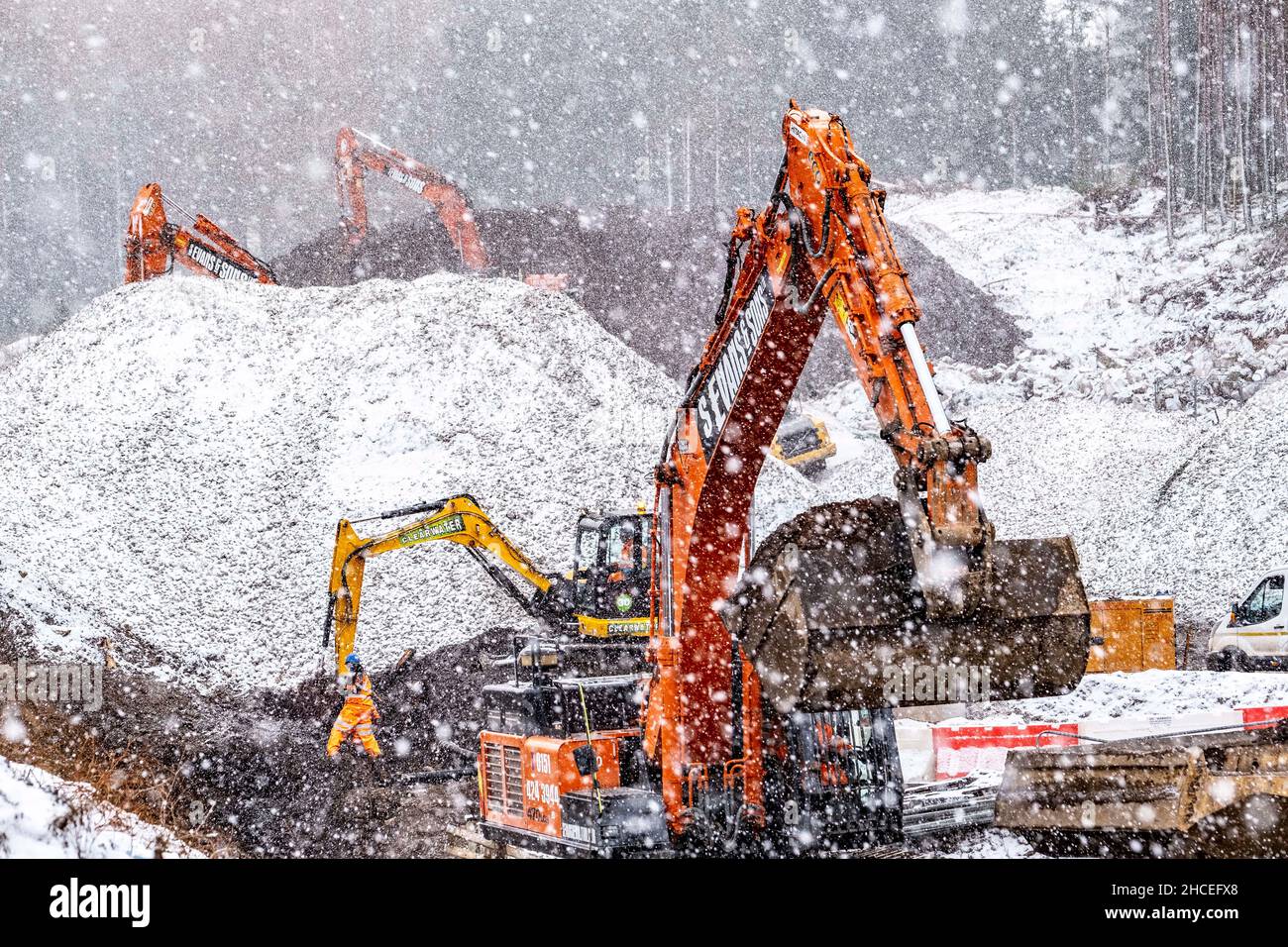 Railway workers building new railway and knocking down bridges Stock Photo