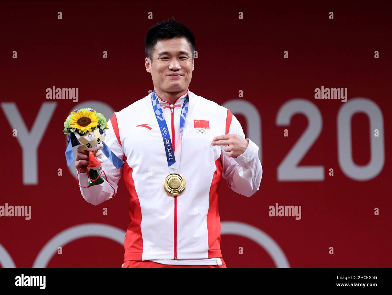 Beijing, China. 31st July, 2021. File photo taken on July 31, 2021 shows Lyu Xiaojun of China gesturing during the awarding ceremony of the weightlifting men's 81kg event at the Tokyo 2020 Olympic Games in Tokyo, Japan. Lyu Xiaojun, 37, became the oldest man to win an Olympic gold medal in weightlifting with victory in the men's 81-kilogram category at Tokyo 2020. It was Lyu's third Olympic medal after gold (2012) and silver (2016) in the 77kg category, making him the first Chinese weightlifter to rack up more than two Olympic medals. Credit: Yang Lei/Xinhua/Alamy Live News Stock Photo