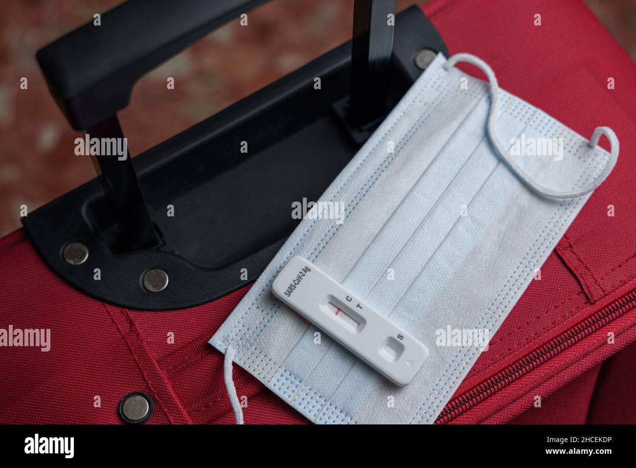 Negative antigen rapid test, face mask and baggage. Covid and travel