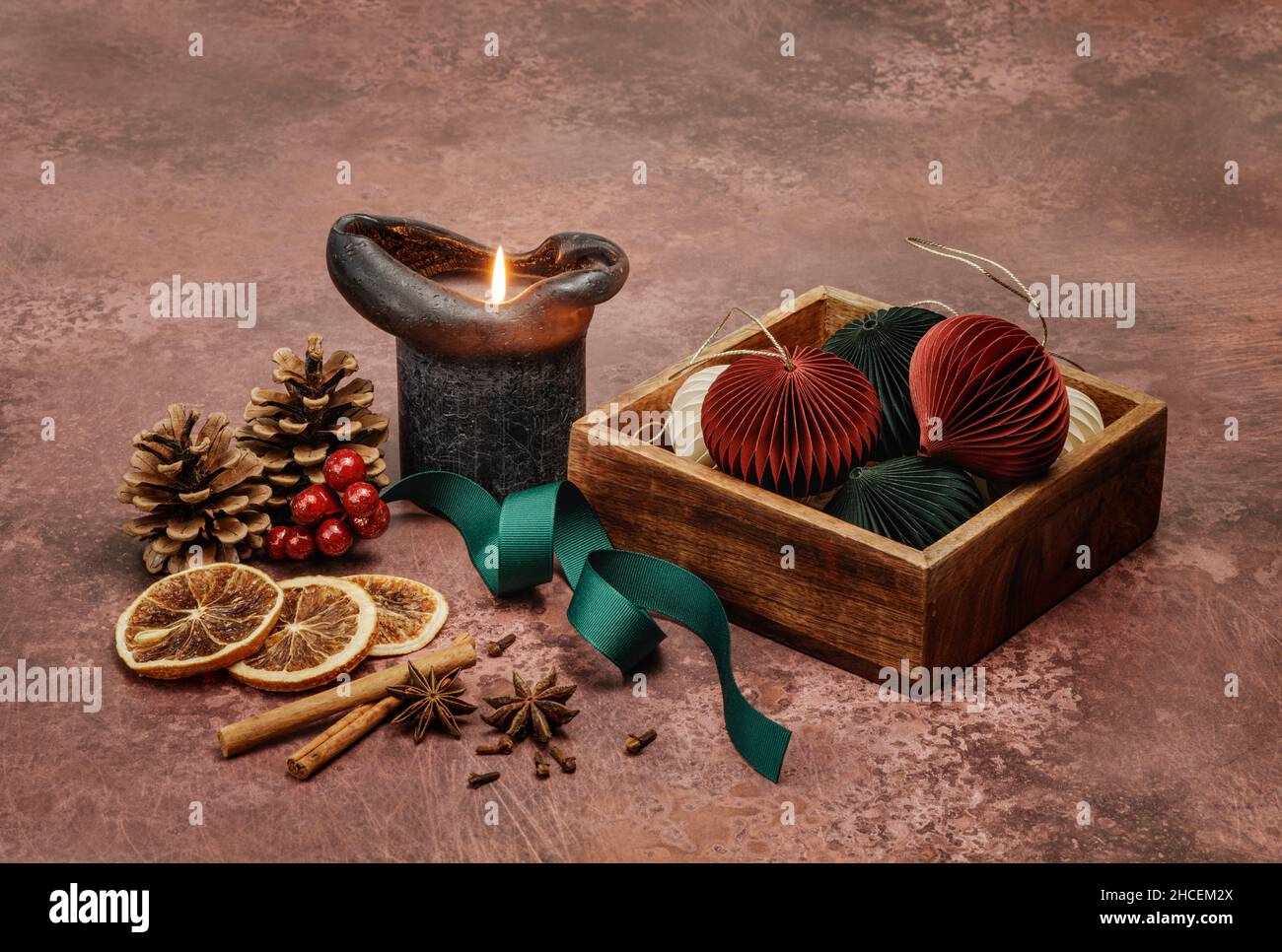 Burning black candle with Christmas objects Stock Photo Alamy