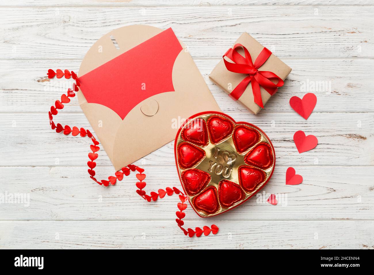Envelope on colored background for Valentine Day with gift box and ...