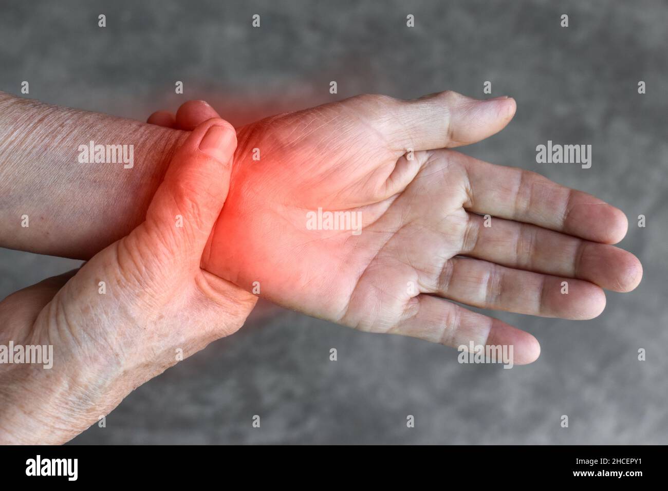 Pain in the wrist joint of Southeast Asian elder woman. Concept of hand