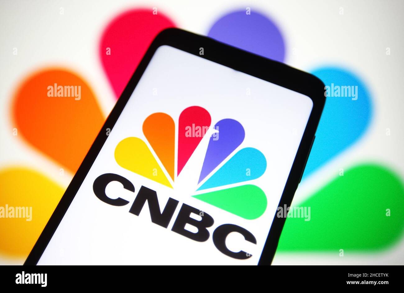 In this photo illustration, CNBC (Consumer News and Business Channel) logo is seen on a smartphone screen. Stock Photo