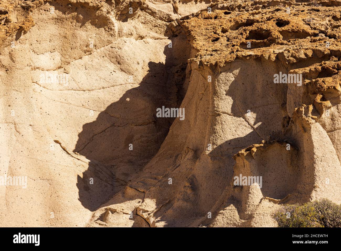 Big cat shadow formed by rock shapes in an area of wind eroded pumice stone known as the Natural monument of Los Derriscaderos in Granadilla, Tenerife Stock Photo