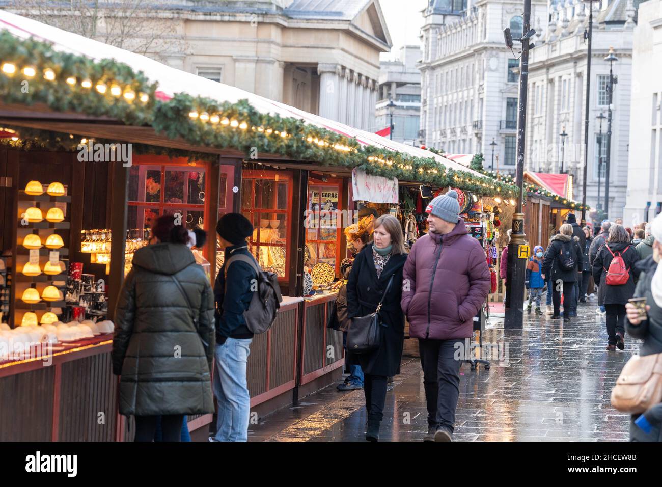 London, UK. 28th Dec, 2021. A Christmas market in Trafalgar Square London attracts visitors during the boxing day bank holiday. Credit: Ian Davidson/Alamy Live News Stock Photo