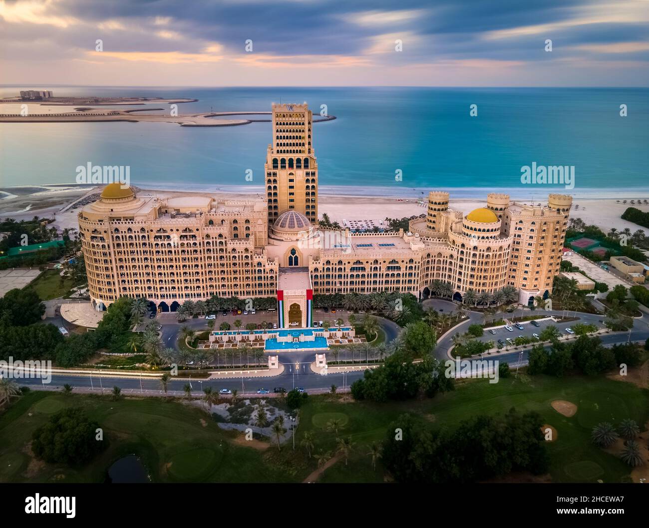 Ras Al Khaimah, United Arab Emirates - December 4, 2021: Waldorf Astoria hotel and resort in Ras al Khaimah near Al Hamra village aerial long exposure Stock Photo